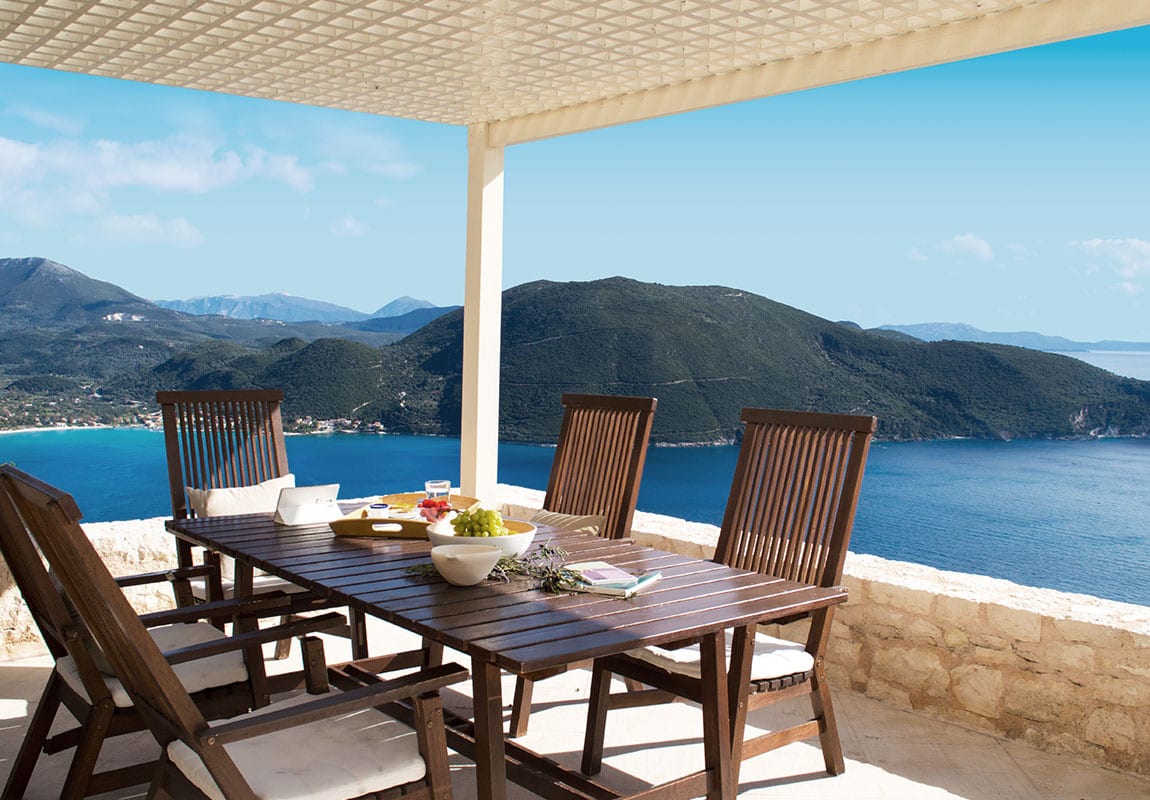 Urania Villas Lefkada Greece - Villa Eos Lefkada close up of the dining table and the beautiful blue views of the area